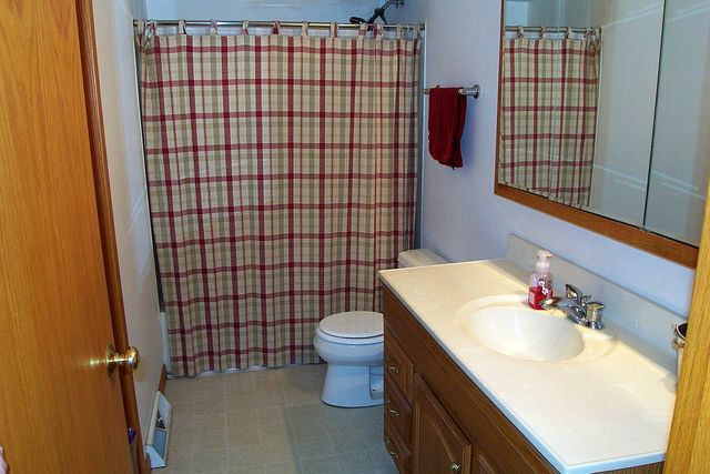 320 Kay Street Manhattan, IL 60442 - Photo 17 of 27 a bathroom with a sink toilet and shower