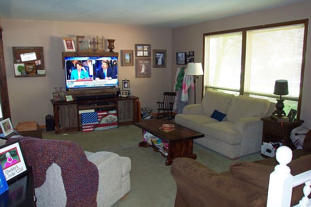320 Kay Street Manhattan, IL 60442 - Photo 7 of 27 a living room with furniture a floor to ceiling window and a flat screen tv
