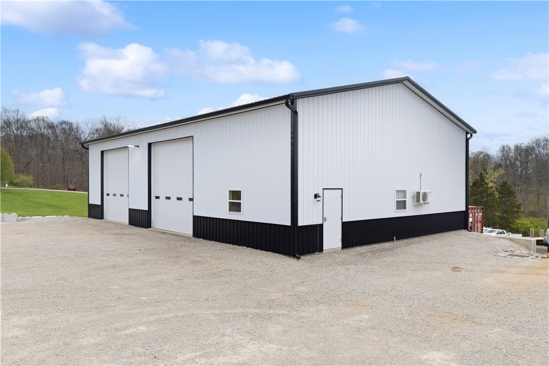 1158 Pyle Road Clarksville, OH 45113 - Photo 59 of 76 This newly (2024) 40x64 constructed outbuilding features two 14' garage doors and ample gravel parking.