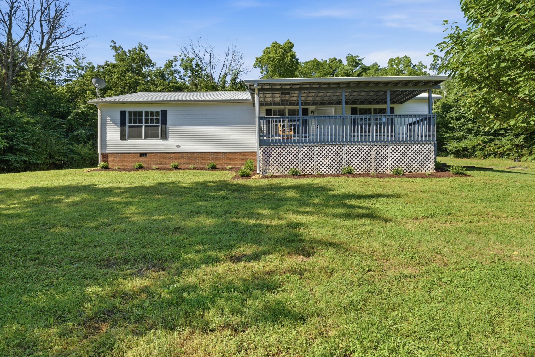 1021 B Jordan Road Lascassas, TN 37085 - Photo 12 of 58 a front view of a house with garden