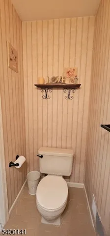 a bathroom with a toilet and a sink