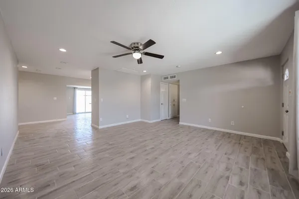 a view of an empty room with a window