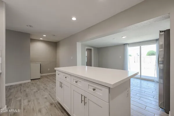 a view of a hallway with an empty room
