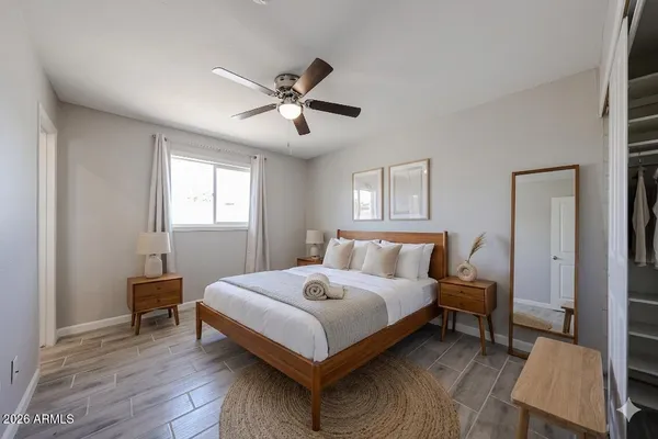 a bedroom with a bed and a window