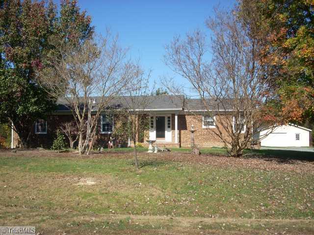 4809 Cade Road Climax, NC 27233 - Photo 1 of 10 Exterior Front. 1.06 Acres with oversized detached garage & workshop. Grape vines and fruits trees and room for garden too!