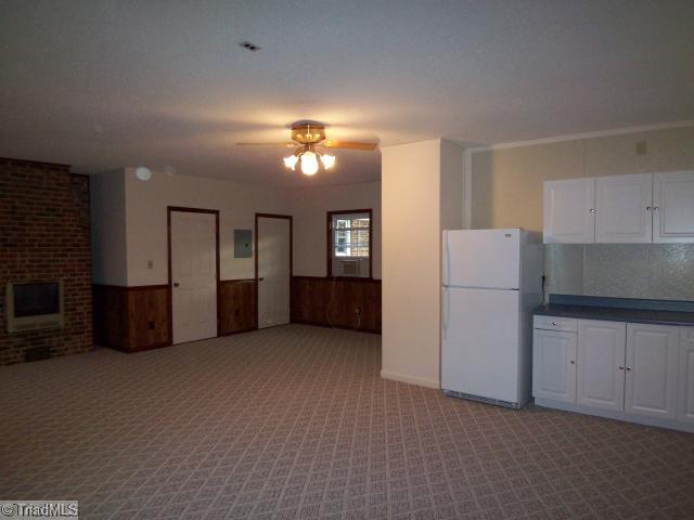 4809 Cade Road Climax, NC 27233 - Photo 6 of 10 Game. HUGE Game room, private suite (day care area may be possible) with separate entrance, 3 closets, electrical for stove, refrigerator, cabinetry, gas heat and air.