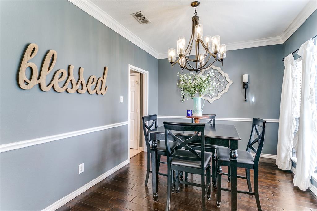 227 Moss Hill Road Irving, TX 75063 - Photo 4 of 27 a view of a dining room with furniture window and wooden floor