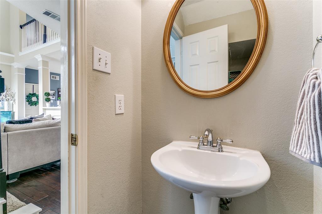 227 Moss Hill Road Irving, TX 75063 - Photo 5 of 27 a bathroom with a sink and a mirror