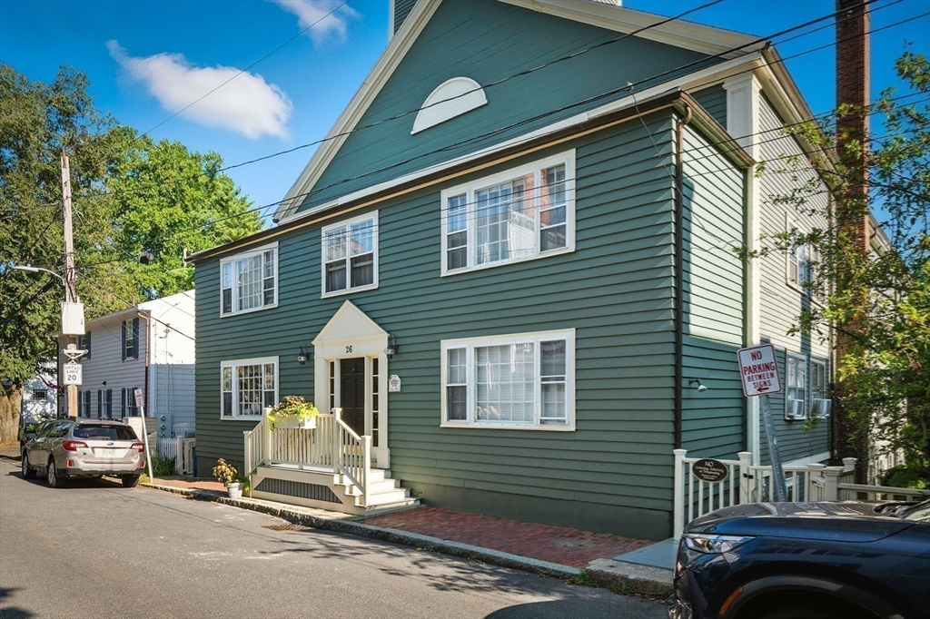 a view of a car park in front of a house