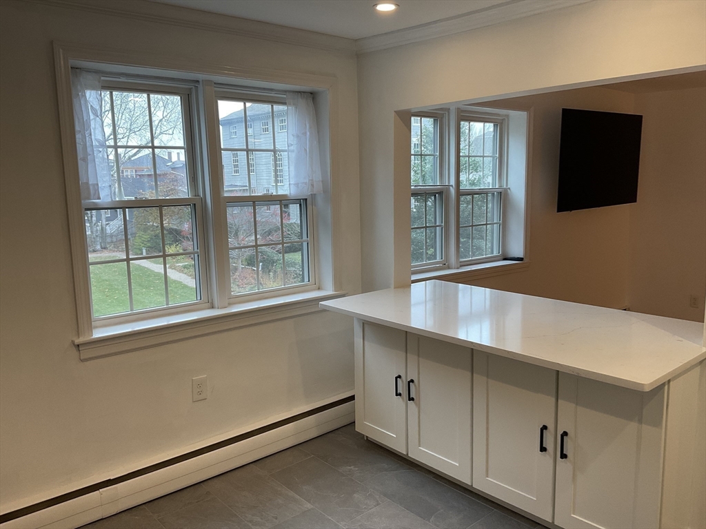 26 Summer Street, Unit 8 Marblehead, MA 01945 - Photo 7 of 23 an empty room with windows