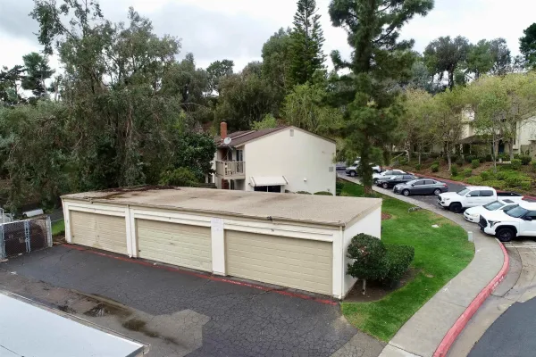 a view of house with a yard