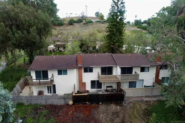 an aerial view of residential houses with outdoor space