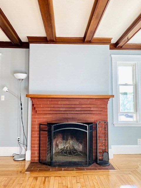 117 Beach Street Quincy, MA 02170 - Photo 3 of 20 a living room with a fireplace in it