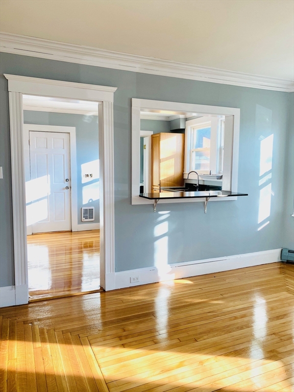 117 Beach Street Quincy, MA 02170 - Photo 10 of 20 a view of a room with wooden floor and a window