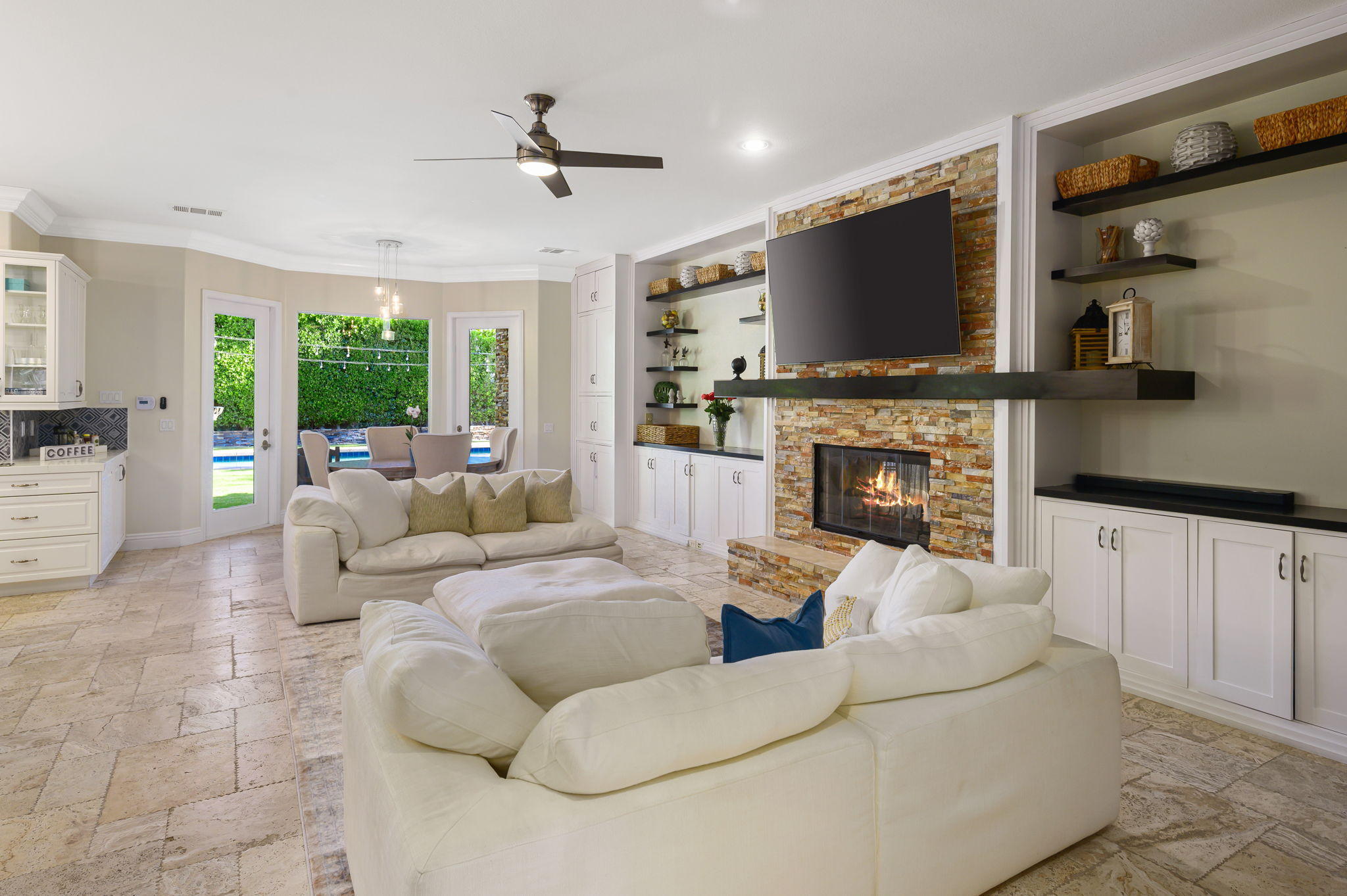 43 Provence Way Rancho Mirage, CA 92270 - Photo 11 of 31 a living room with fireplace furniture and a flat screen tv
