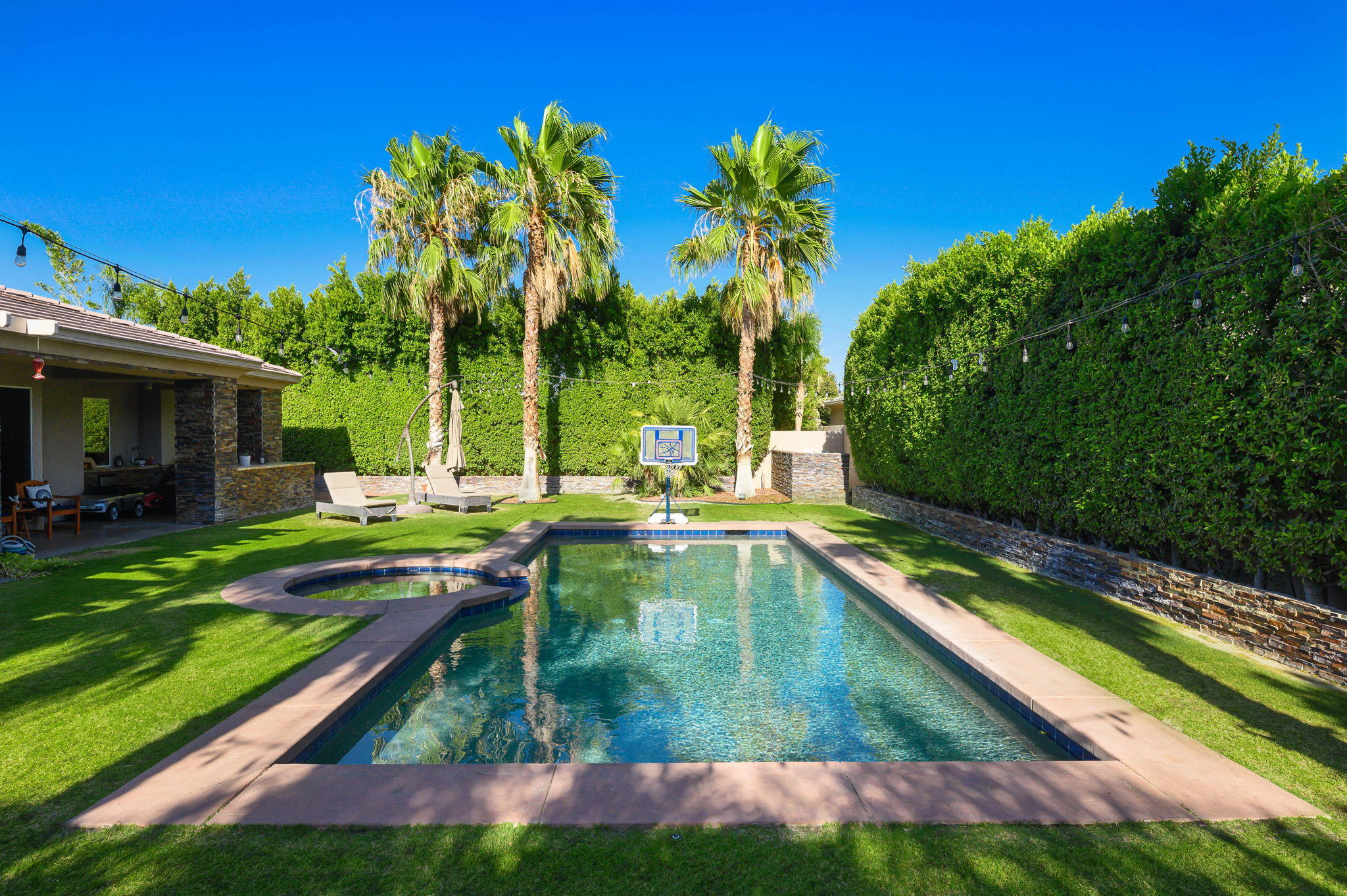 43 Provence Way Rancho Mirage, CA 92270 - Photo 26 of 31 a view of swimming pool from a lounge chair