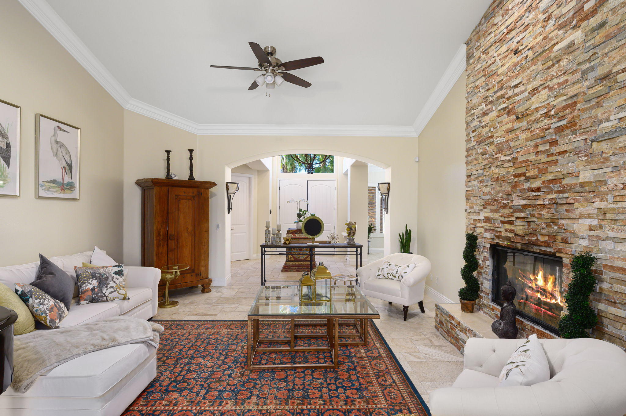43 Provence Way Rancho Mirage, CA 92270 - Photo 4 of 31 a living room with furniture and a fireplace