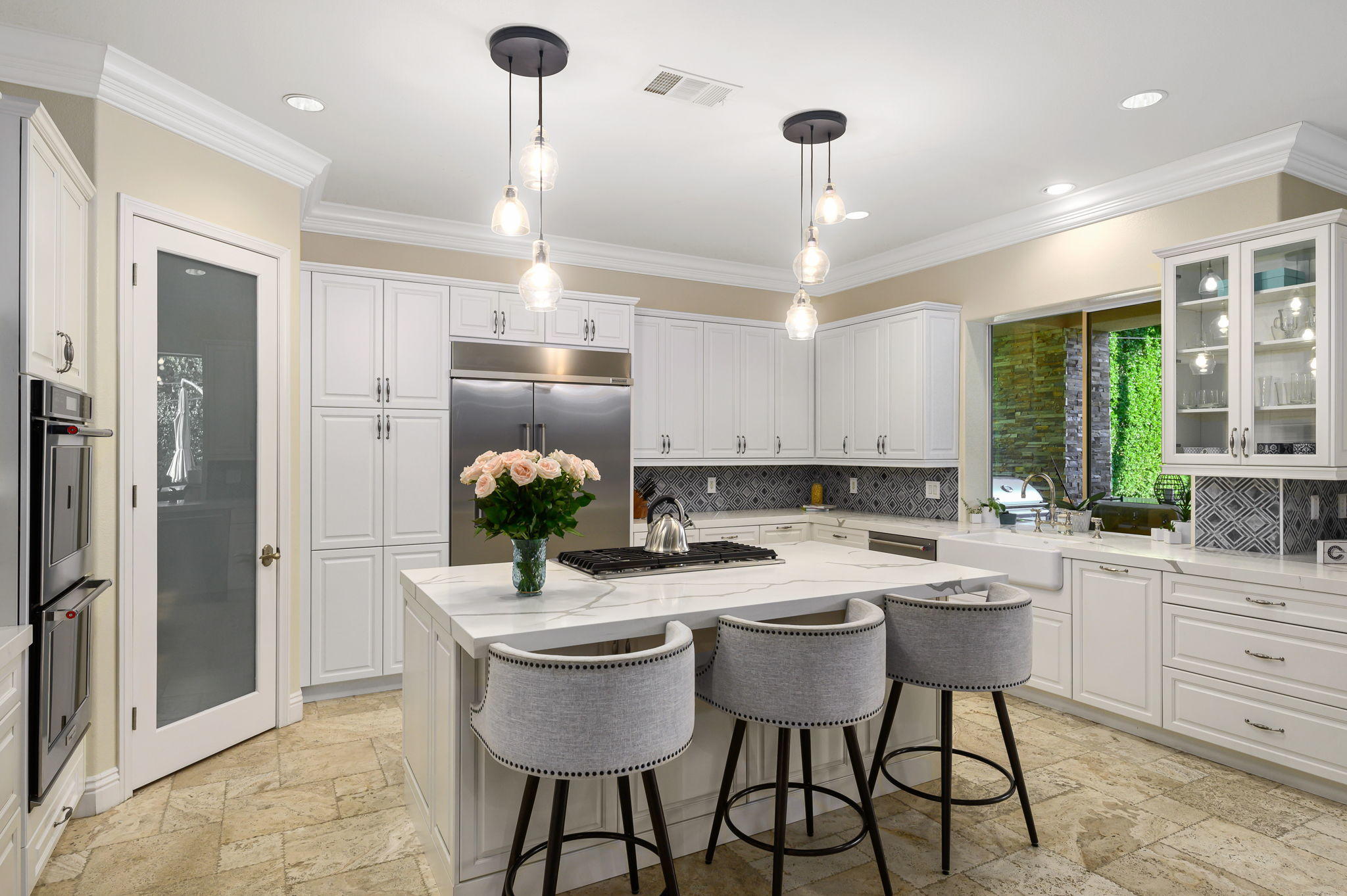 43 Provence Way Rancho Mirage, CA 92270 - Photo 7 of 31 a kitchen with a dining table chairs sink and refrigerator