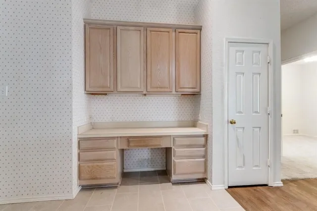 a view of cabinets and wooden floor