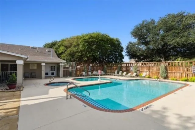 a view of a swimming pool with chairs