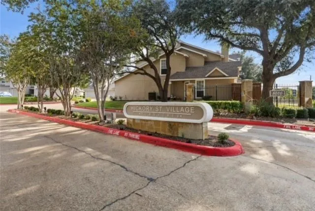 a view of house with outdoor space and trees around