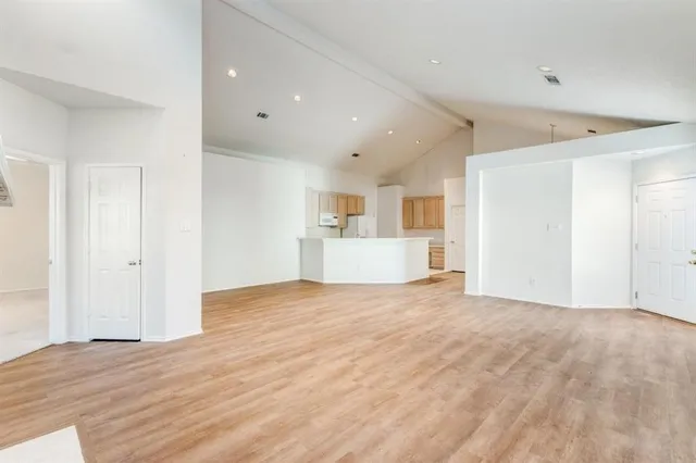 a view of a livingroom with wooden floor