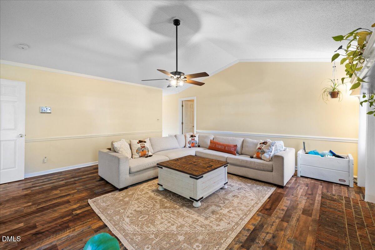 850 Lewis Winstead Loop Roxboro, NC 27574 - Photo 11 of 49 a living room with furniture and a rug