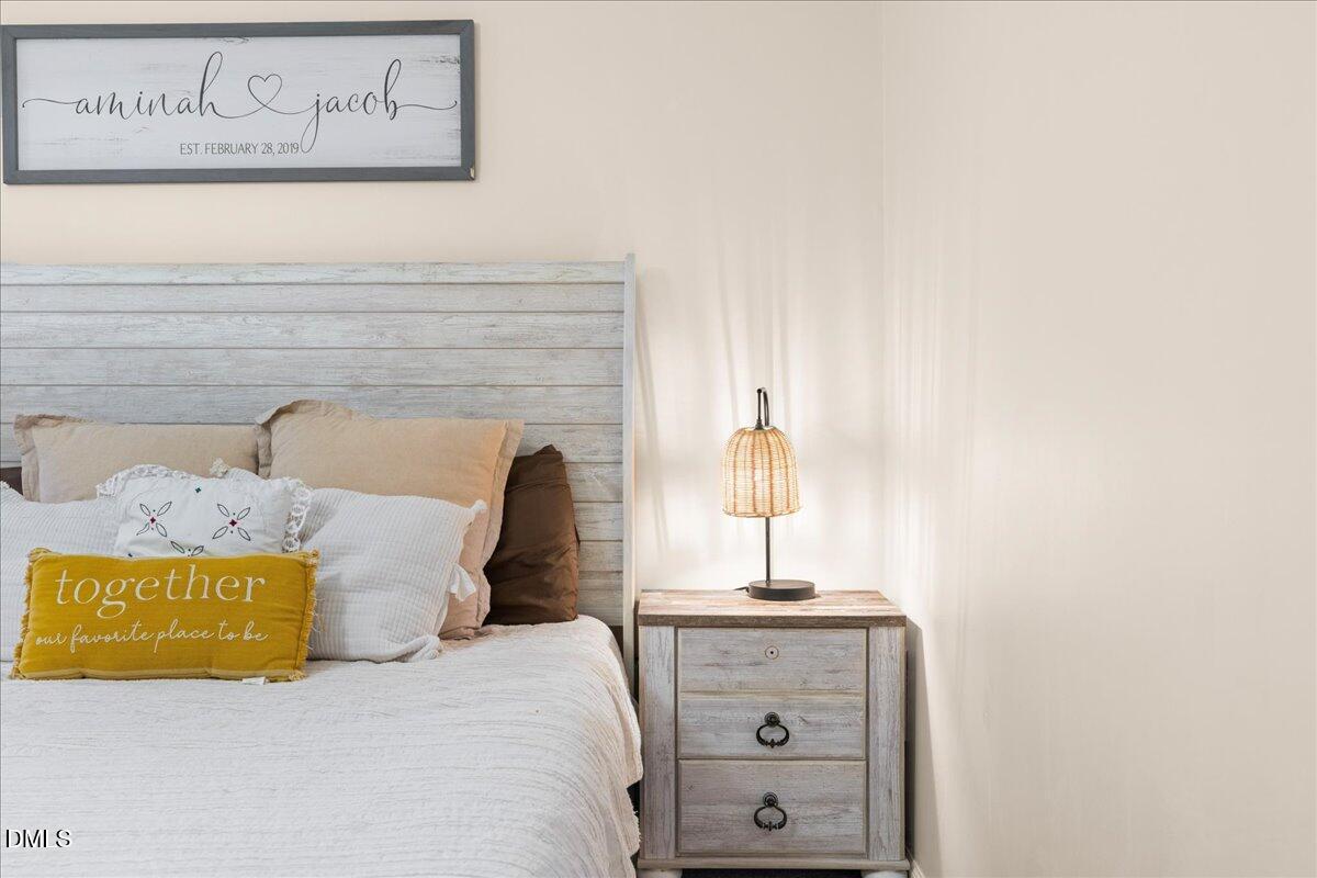 850 Lewis Winstead Loop Roxboro, NC 27574 - Photo 17 of 49 a bedroom with a bed and a window