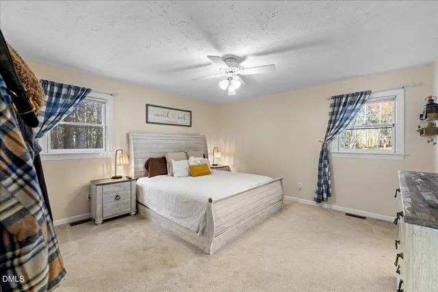 a bathroom with a sink vanity and mirror
