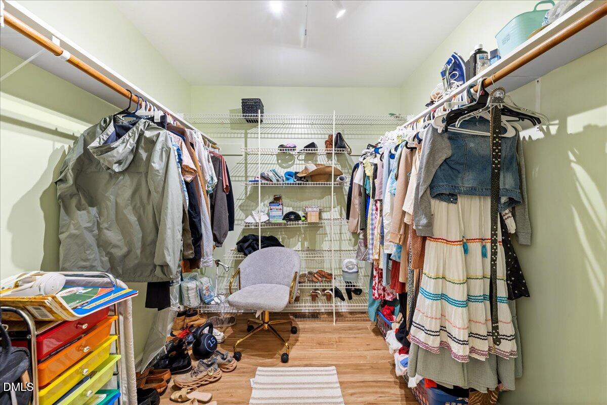 850 Lewis Winstead Loop Roxboro, NC 27574 - Photo 19 of 49 a view of walk in closet with clothes and shoes