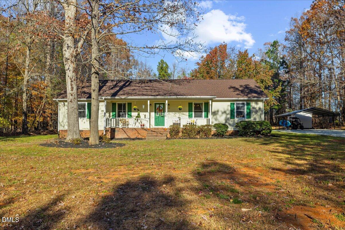 850 Lewis Winstead Loop Roxboro, NC 27574 - Photo 2 of 49 a view of a house with pool and sitting area