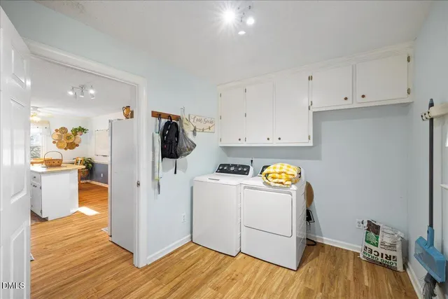 a view of a house with swimming pool and sitting area