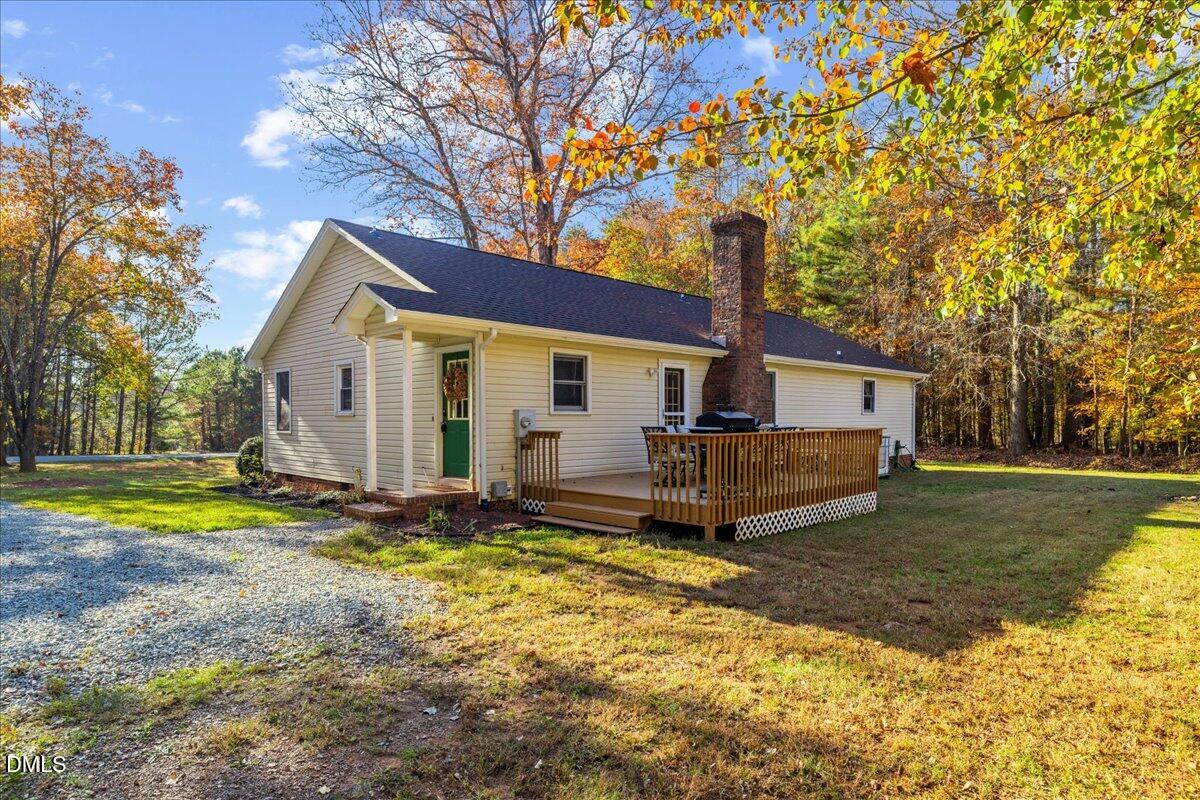 850 Lewis Winstead Loop Roxboro, NC 27574 - Photo 35 of 49 a view of a house with backyard and trees