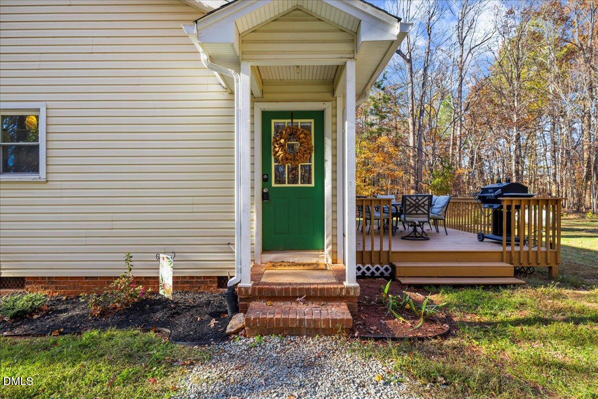 850 Lewis Winstead Loop Roxboro, NC 27574 - Photo 36 of 49 a view of a house with backyard and garden