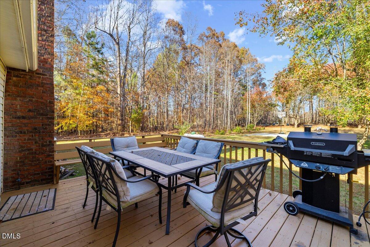 850 Lewis Winstead Loop Roxboro, NC 27574 - Photo 38 of 49 a view of a chairs and table on the deck