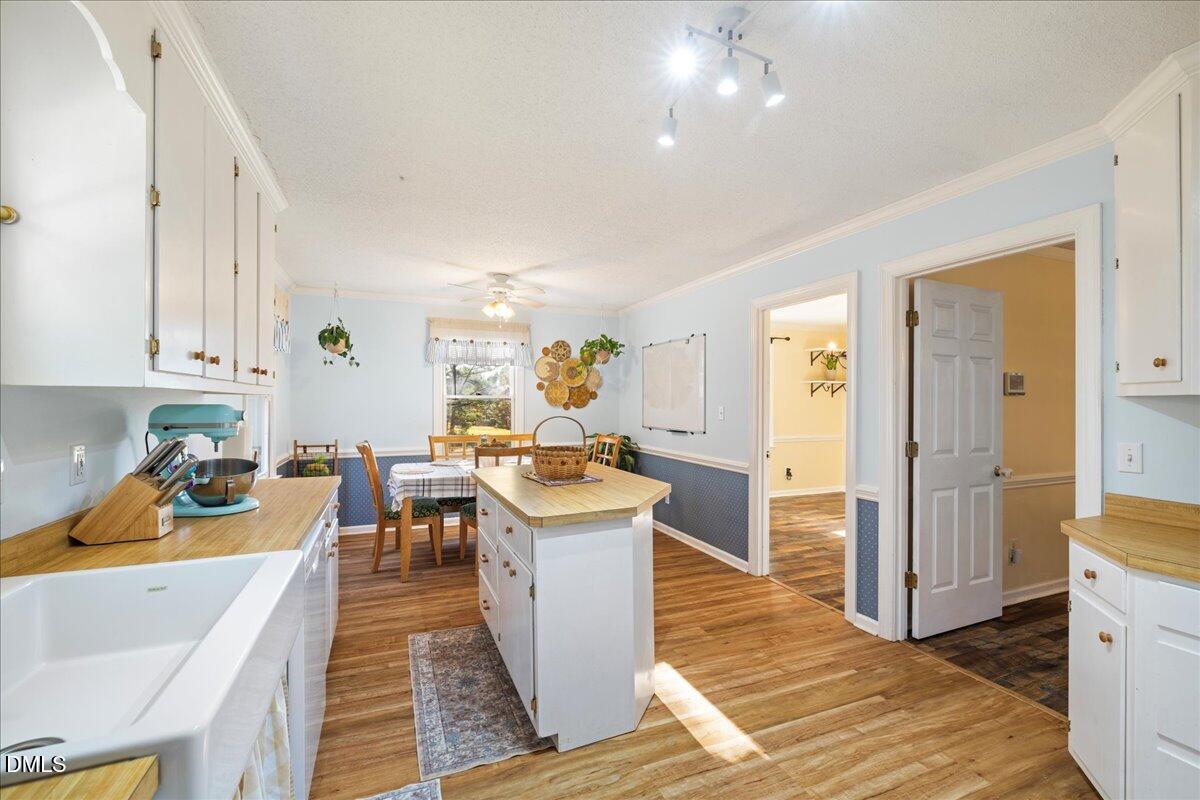 850 Lewis Winstead Loop Roxboro, NC 27574 - Photo 7 of 49 a living room with a couch and wooden floor