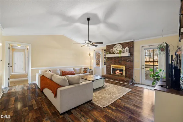 a living room with furniture and a rug