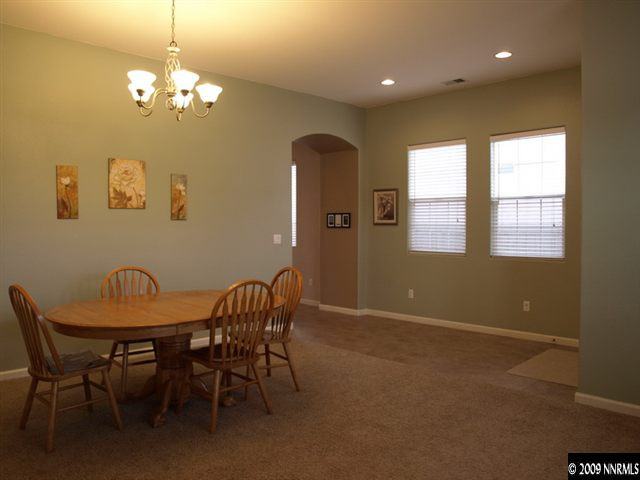 10633 Eagle Falls Way Reno, NV 89521 - Photo 2 of 9 a view of a dining room with furniture and chandelier