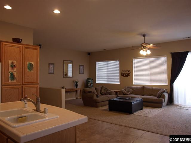 10633 Eagle Falls Way Reno, NV 89521 - Photo 4 of 9 a living room with furniture and a large window