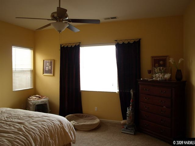 10633 Eagle Falls Way Reno, NV 89521 - Photo 7 of 9 a bedroom with a bed and a dresser