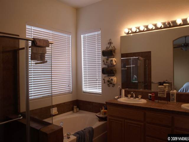 10633 Eagle Falls Way Reno, NV 89521 - Photo 8 of 9 a bathroom with a sink and a mirror