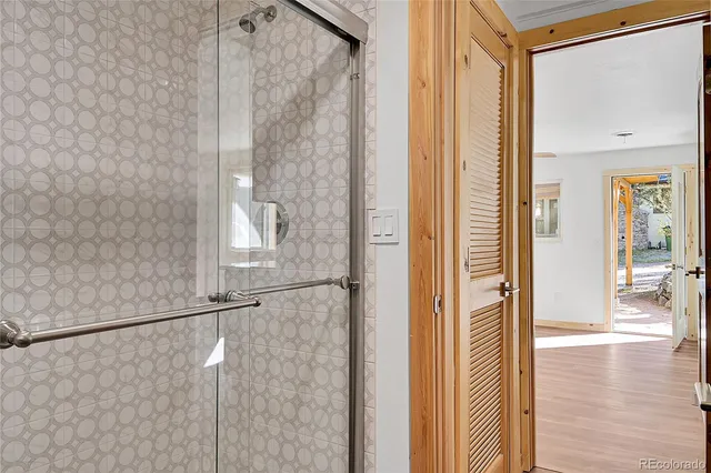 a view of a bathroom from the hallway