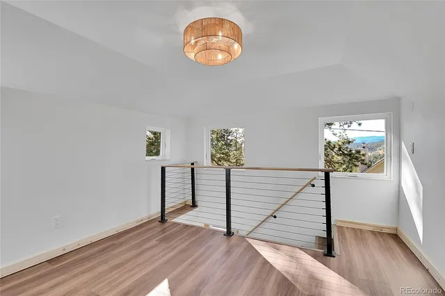a view of entryway with wooden floor