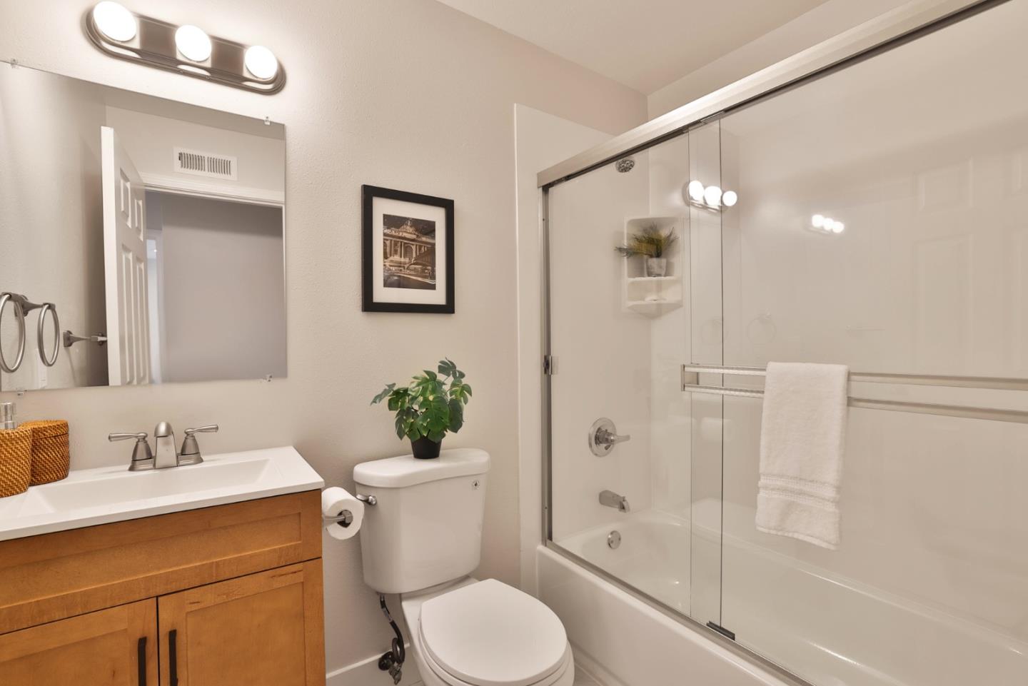 2053 Jonesport Avenue San Jose, CA 95131 - Photo 14 of 28 a bathroom with a sink toilet and shower