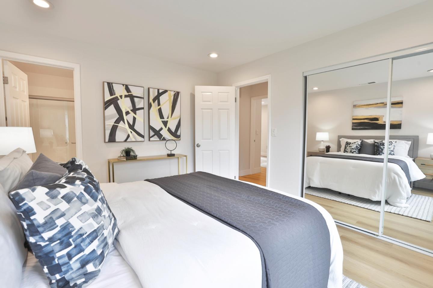 2053 Jonesport Avenue San Jose, CA 95131 - Photo 16 of 28 a bedroom with a large bed and a couch