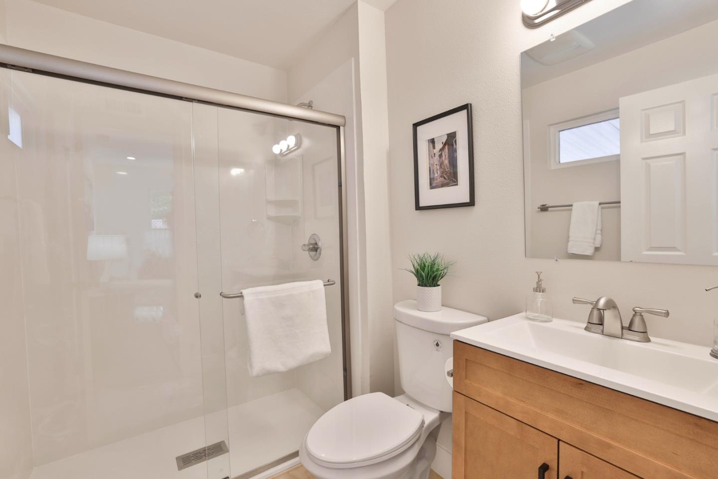 2053 Jonesport Avenue San Jose, CA 95131 - Photo 17 of 28 a bathroom with a sink a toilet and shower