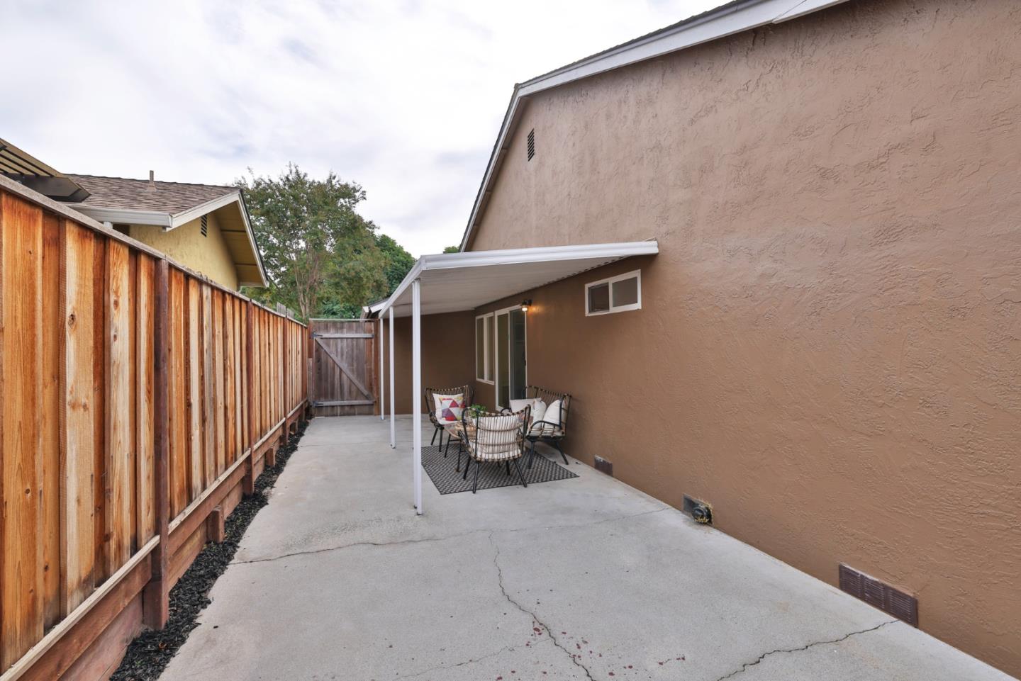 2053 Jonesport Avenue San Jose, CA 95131 - Photo 23 of 28 a balcony with couple of white furniture and wooden deck