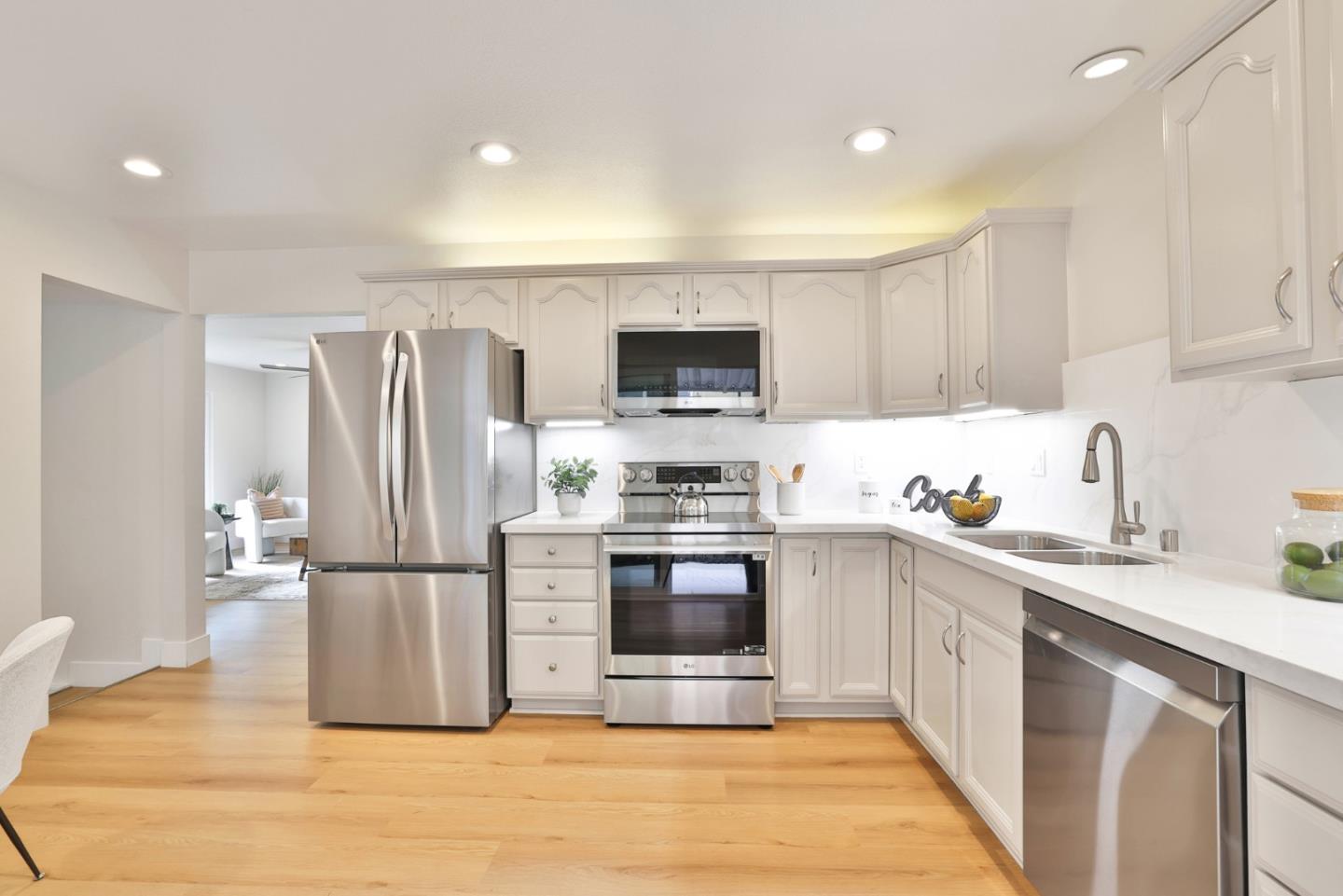 2053 Jonesport Avenue San Jose, CA 95131 - Photo 8 of 28 a kitchen with stainless steel appliances a stove a sink and a refrigerator