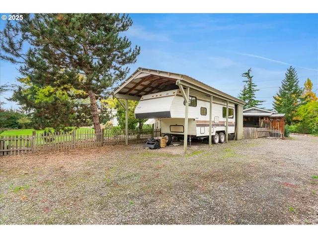 an aerial view of a house with a yard basket ball court and outdoor seating