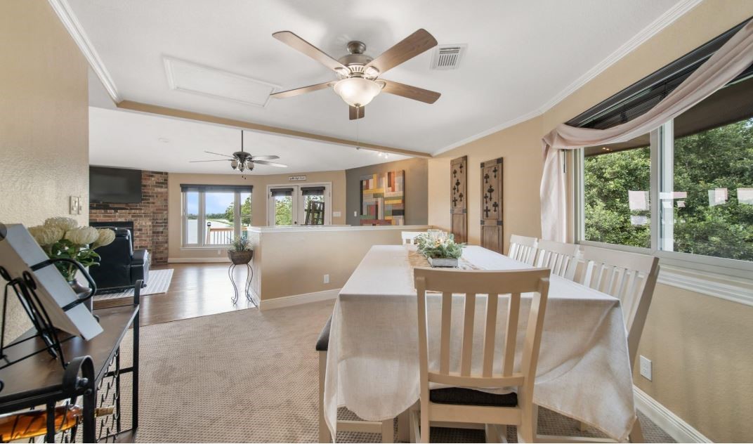 6714 Spray Lane, Unit C699A Rosharon, TX 77583 - Photo 31 of 48 Formal Dining Area is Open to the Family Room. Nice Place to Host Dinner Parties with Stunning Sunset Lake Views on the 3rd Floor Top Deck.